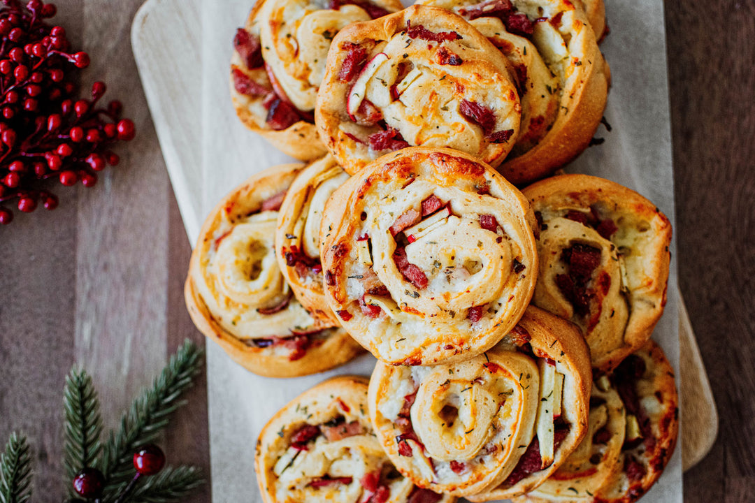 ham cheese and apple pinwheels on a platter