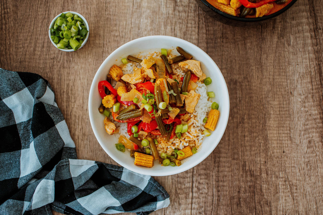 red curry chicken in a bowl over rice