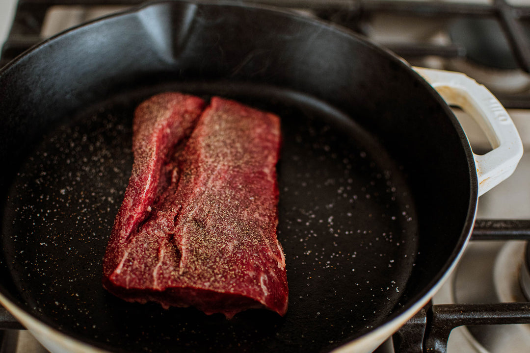 flat iron steak in a skillet