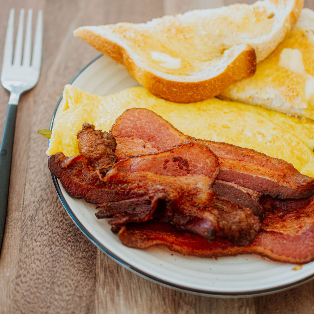 pork bacon a plate with eggs and toast