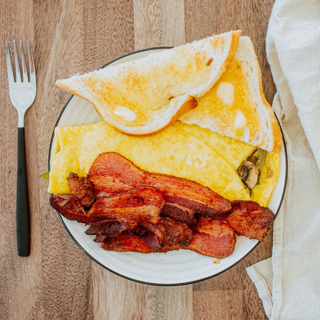 pork bacon a plate with eggs and toast