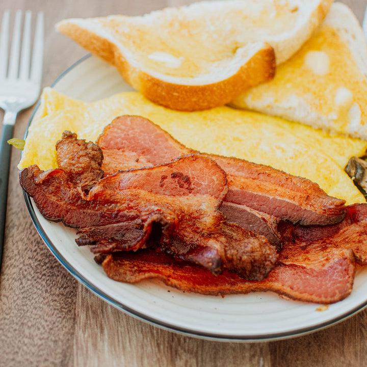 pork bacon a plate with eggs and toast