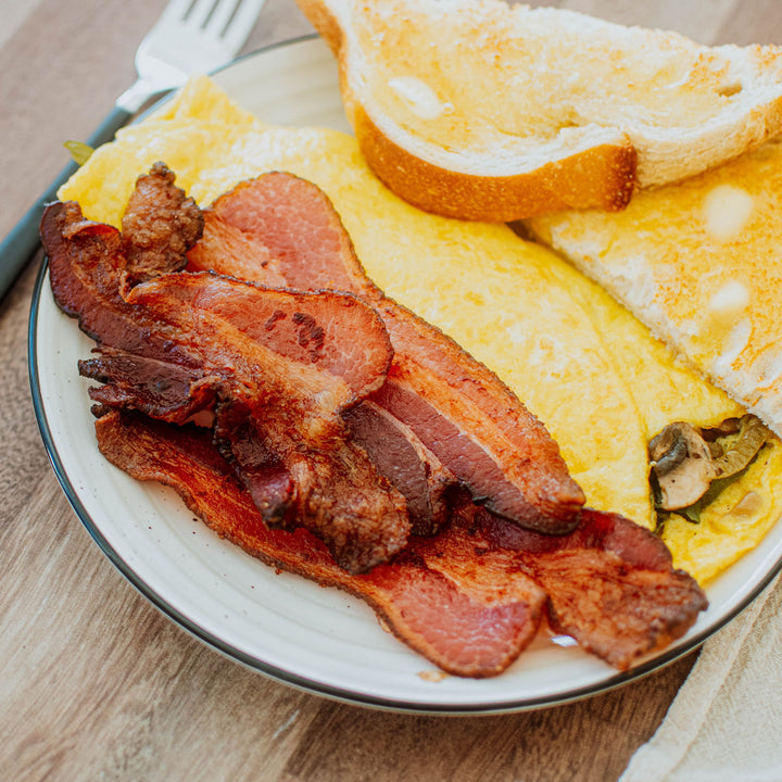 pork bacon a plate with eggs and toast